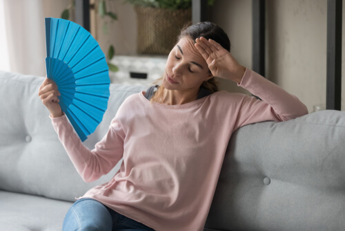 low temperature and sweating in adults